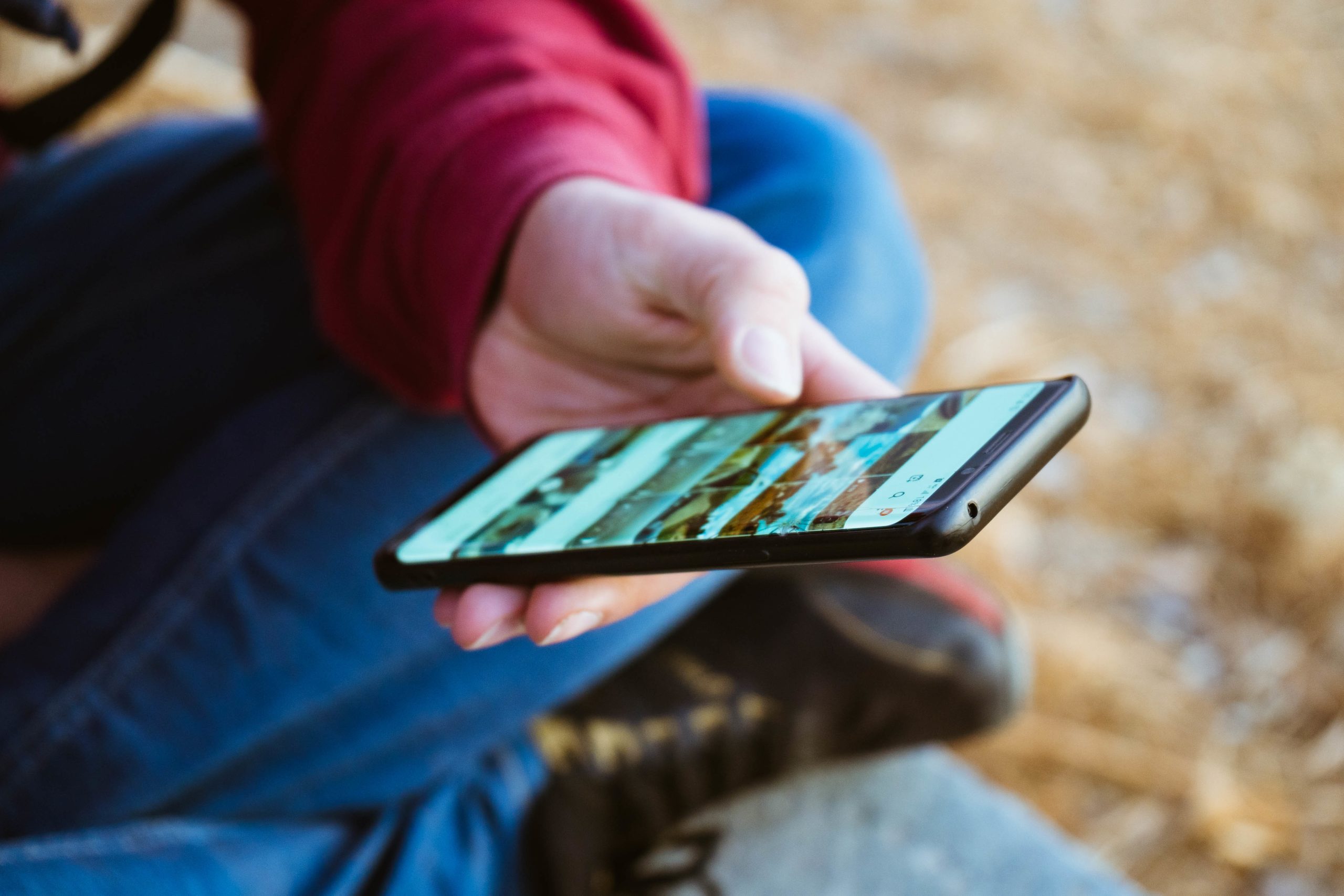 Services-03 Male Hand Using His Phone Scaled