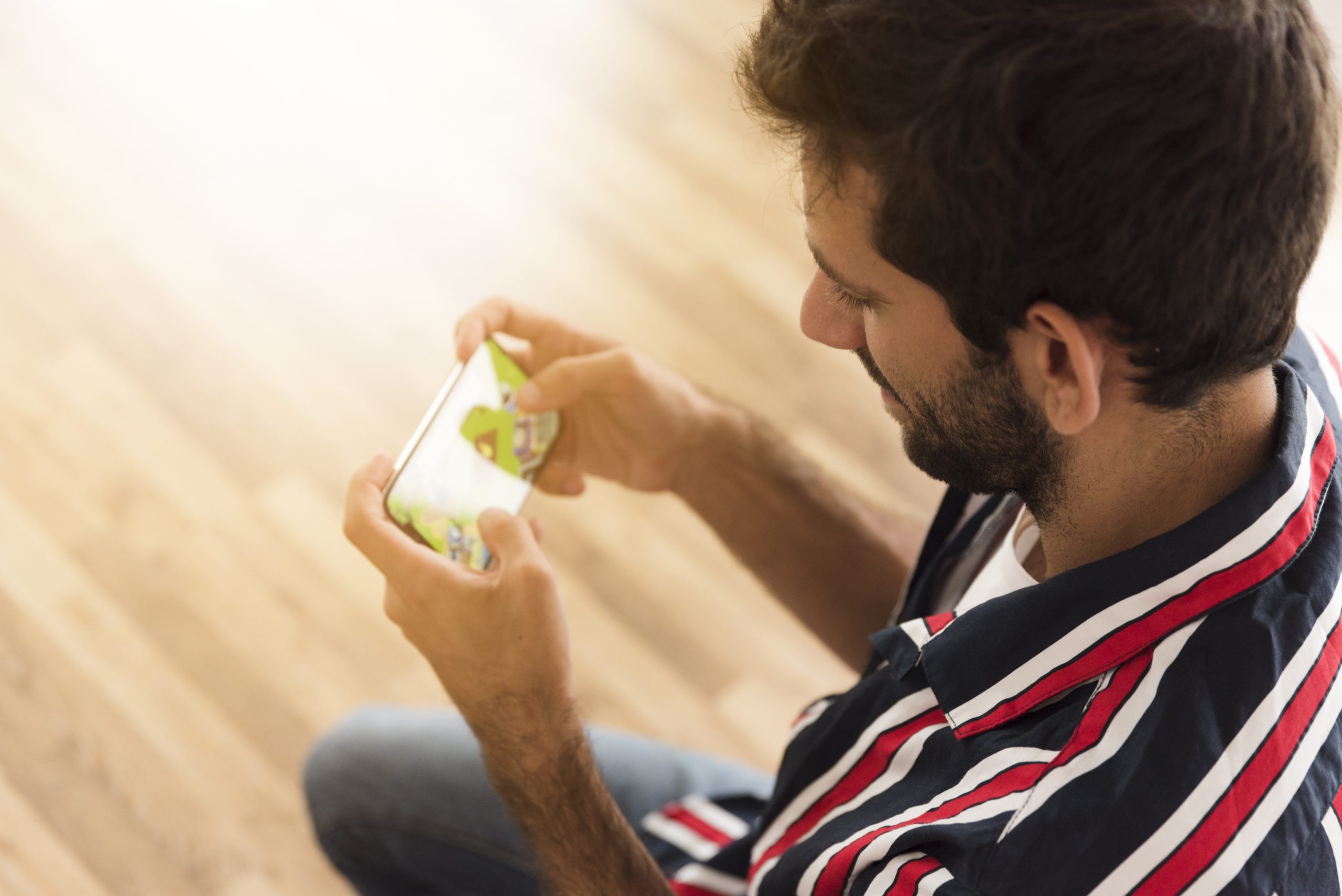 Top View Man Playing Mobile Games Scaled
